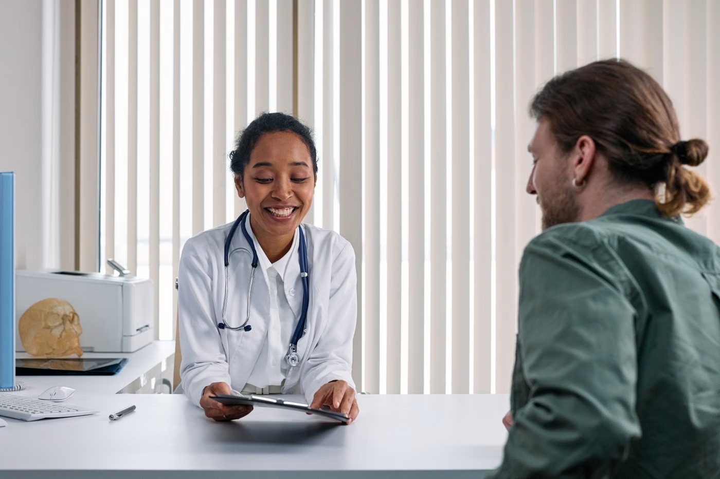 A clinician in consultation with a patient